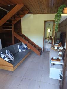a room with a bed and stairs in a room at Chalé Sítio Recanto dos Sonhos in Aimorés +18 photos