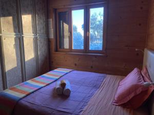 A bed or beds in a room at B&B Villa Letizia