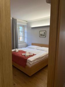 Posteľ alebo postele v izbe v ubytovaní Apartments Cafe Hexe