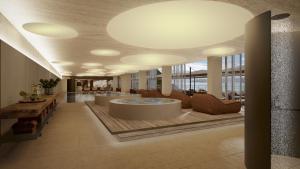 a large lobby with a hot tub in a building at Villa Dubrovnik in Dubrovnik