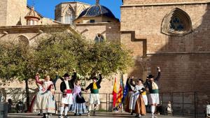 a group of people in costumes standing in front of a building at Cosy Rooms Embajador in Valencia
