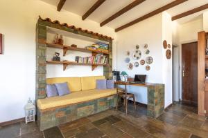 a living room with a bench and a desk at Evia Escape in Diliso