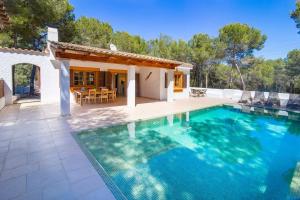 a villa with a swimming pool and a house at Villa Calma by Mallorca Infinity in Santa Ponsa