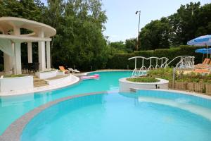 a large swimming pool with a water slide at Bellevue golden sands in Golden Sands