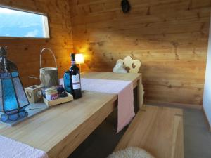 a room with a bed in a wooden cabin at Chalet Safran in Grächen