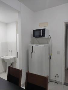 Et tv og/eller underholdning på Flat em Itaguaí