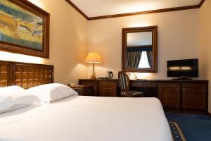 Posteľ alebo postele v izbe v ubytovaní Grand Hotel Trento