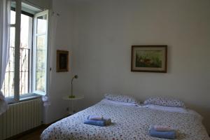 Postel nebo postele na pokoji v ubytování B&B I Ghiri