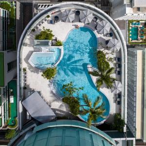 an aerial view of a swimming pool in a building at InterContinental Bangkok by IHG in Bangkok