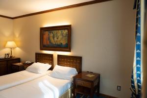 Posteľ alebo postele v izbe v ubytovaní Grand Hotel Trento