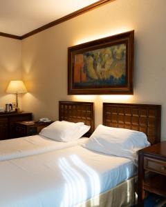 Posteľ alebo postele v izbe v ubytovaní Grand Hotel Trento