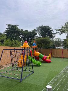 a playground with slides and a play equipment at Aisywara Homestay Kuala Terengganu in Kuala Terengganu +28 photos