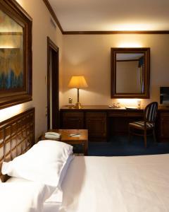 Posteľ alebo postele v izbe v ubytovaní Grand Hotel Trento