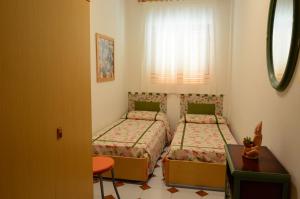 Postel nebo postele na pokoji v ubytování Brigitta Flat