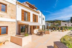 a villa with a view of the ocean at Casita Marinera Sant Elm by Mallorca Infinity in Sant Elm