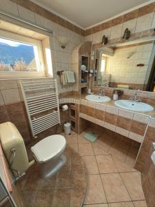 Koupelna v ubytování Sobe-Apartma