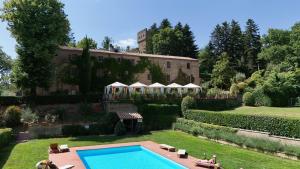 a house with a swimming pool in the yard at Castello Santa Cristina in Grotte di Castro +46 photos