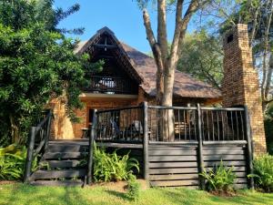 a house with a gate in front of it at Kruger Park Lodge - Private Villa 514 in Hazyview +39 photos