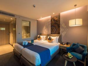 Grand Mercure Mysore - An Accor Brand客房内的一张或多张床位