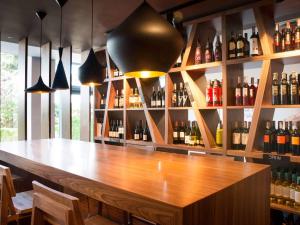 a bar with a lot of bottles of wine at Mercure Gdańsk Posejdon in Gdańsk