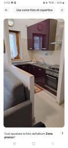 a kitchen with a couch and a sink and a stove at La tana del gladiatore 67 in Rome