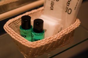 two bottles of disinfectants sitting in a basket at San Peter Rome B&B in Rome