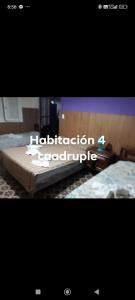 a picture of a bed with the words educationfourth comfortable at Hotel Cuatro Soles in Mar del Plata
