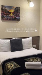 Postel nebo postele na pokoji v ubytování Шляпа