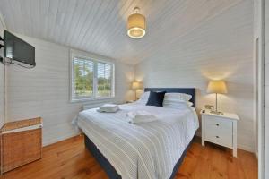 Katil atau katil-katil dalam bilik di Host & Stay - Mahonia Lodge