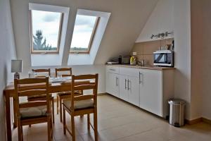 A kitchen or kitchenette at Völgy Vendégház