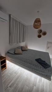 a bedroom with a large bed in a room at Villa Meraki in Kastraki