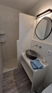 a bathroom with a sink and a mirror at Villa Meraki in Kastraki +38 photos