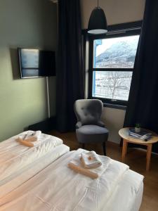 Ένα ή περισσότερα κρεβάτια σε δωμάτιο στο True Vesterålen Hotel