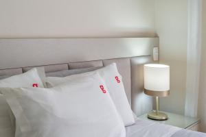 Cama ou camas em um quarto em Morada Real 405 - Apê novo no Centro de Canela