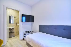Postel nebo postele na pokoji v ubytování Hotel Gran Vía by gaiarooms