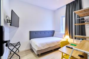 Postel nebo postele na pokoji v ubytování Hotel Gran Vía by gaiarooms