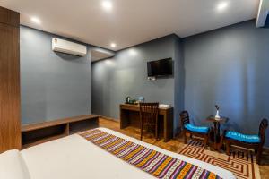 Televizorius ir (arba) pramogų centras apgyvendinimo įstaigoje Hotel Yukhang