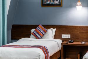 Lova arba lovos apgyvendinimo įstaigoje Hotel Yukhang