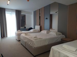 Letto o letti in una camera di Hotel Almanas