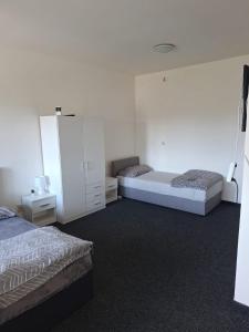 Postel nebo postele na pokoji v ubytování Apartmán U Radka