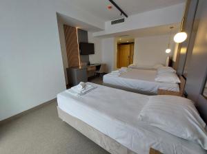 Letto o letti in una camera di Hotel Almanas