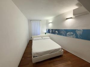 Postel nebo postele na pokoji v ubytování Mare Mosso 2