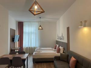 Postel nebo postele na pokoji v ubytování Aviendo Old Town Apartments