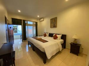 Postel nebo postele na pokoji v ubytování Brata Inn Ubud