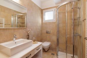 a bathroom with a sink and a shower and a toilet at SunBreeze-Beachfront Luxury Villa 5 Bed 4 bath-Sleeps 10 in Potámion +83 photos