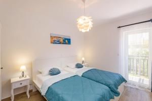 Postel nebo postele na pokoji v ubytování Apartments Morska Vila