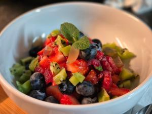 a white bowl filled with fruits and vegetables at Number 6 in St Austell