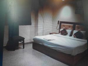Postel nebo postele na pokoji v ubytování Hotel O Metro Residency