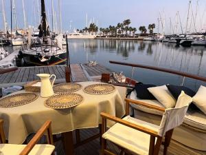 a table and chairs on a boat in a marina at Xanquete in Valencia