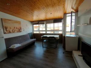 a living room with a couch and a table at AMAIKA AH Rentals in Peniscola